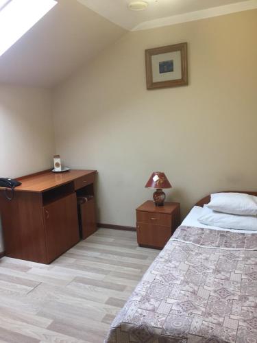 Postel nebo postele na pokoji v ubytování Atlant Hotel