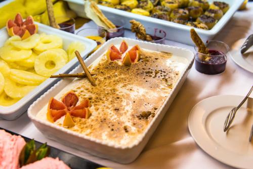a table topped with a tray of food with fruit at Kn Hotel Matas Blancas - Solo Adultos in Costa Calma
