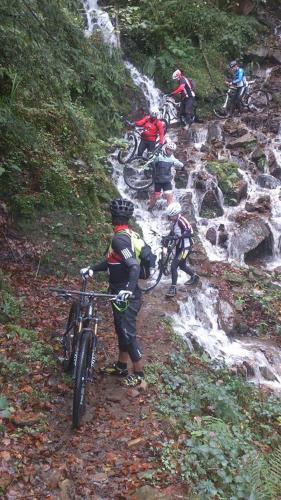 a group of people riding bikes on a mountain trail at Mendi Alai in Carranza