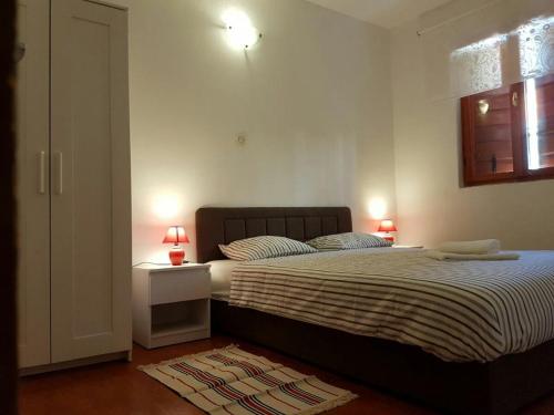 Кровать или кровати в номере Nautica Apartments