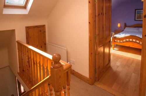 a hallway with a staircase leading to a bedroom at Cottage 259 - Renvyle in Renvyle