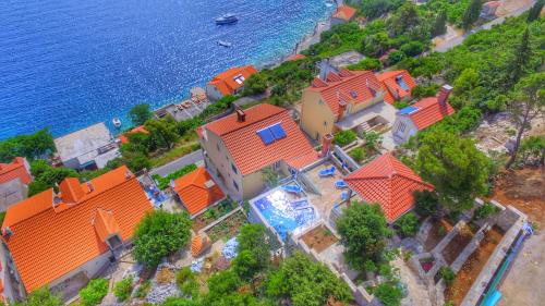 an aerial view of a house with orange roofs at Adriatic-house & seaview pool in Sobra