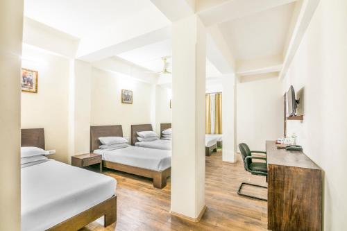 Ένα ή περισσότερα κρεβάτια σε δωμάτιο στο Hotel Sher-E-Punjab & Spa