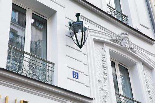 a street light on the side of a building at Maison Bréguet in Paris