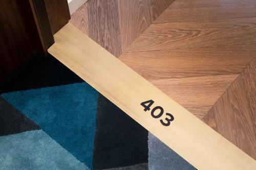 a wooden floor with the number on it at Maison Bréguet in Paris