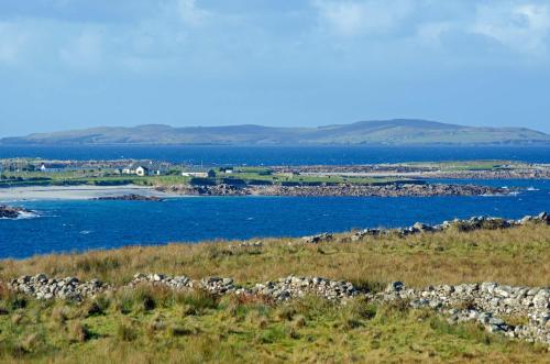 a view of a body of water from a hill at Cottage 238 – Cleggan in Cleggan