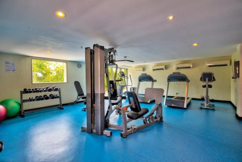 a gym with treadmills and exercise equipment in a room at Estelar Playa Manzanillo - All inclusive in Cartagena de Indias