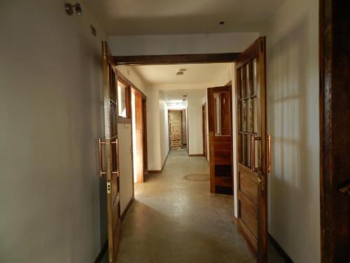 a hallway of a house with doors and a hallway at Aroma Verde Hotel in Valdivia