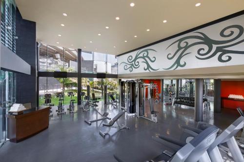 a gym with cardio equipment in a building at Hard Rock Hotel Cancun - All Inclusive in Cancún