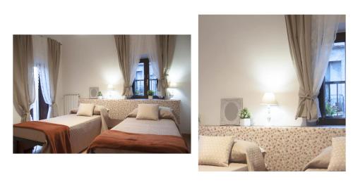 a living room with two beds and a window at Il Palazzetto sulla Francigena in Formello