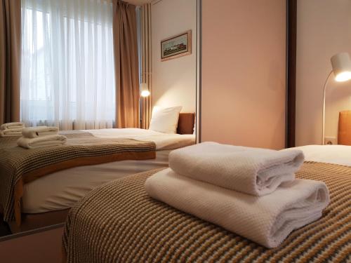 Postel nebo postele na pokoji v ubytování Dafni Apartment