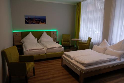 En eller flere senge i et værelse på Minx – CityHotels