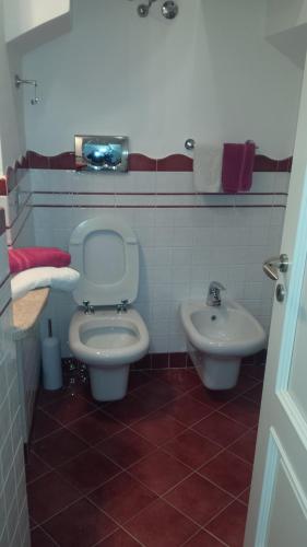 a bathroom with a toilet and a sink at Casa Duomo in Amalfi