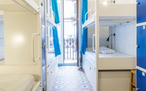 a corridor of a dorm room with bunk beds at Soul Backpackers Barcelona in Barcelona