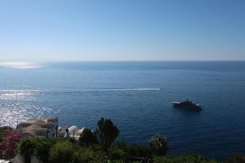 a boat in the middle of a large body of water at Turchese in Amalfi