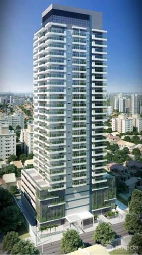 a tall building in a city with buildings at Studio mobiliado in Santos
