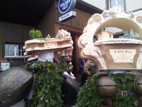 a store front with a display of trees and a building at Hotel Garni Traube B&B in Schwellbrunn