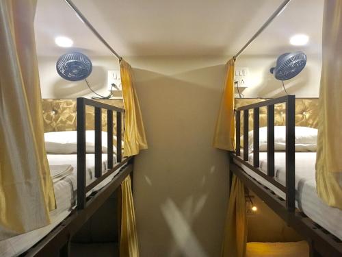 a couple of bunk beds in a room at golden dormitory in Mumbai