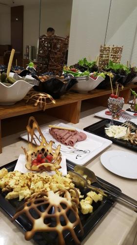 a table with many plates of food on it at Lamec Hotel Business in Gebze