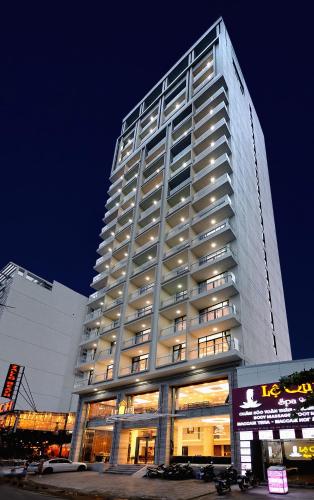 a tall building with lights on the side of it at Lenid Ocean View Hotel in Nha Trang