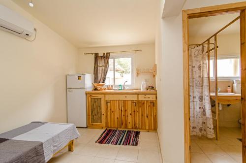 Postel nebo postele na pokoji v ubytování Desert Routes Inn Shvilim ba Midbar