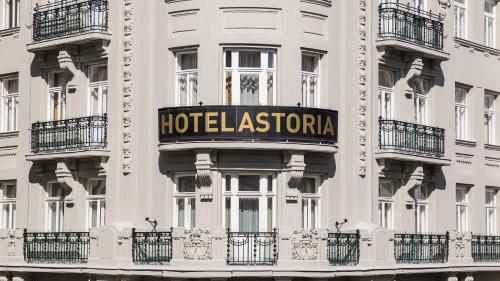 a hotel association sign on the side of a building at Hotel Astoria Vienna, Curio Collection by Hilton in Vienna