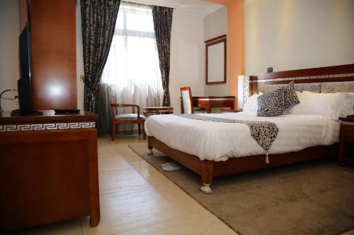 Ένα ή περισσότερα κρεβάτια σε δωμάτιο στο Vamos Guest House