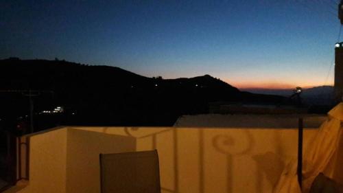 a view of the sunset from the roof of a building at Studio Galatia, in the heart of Kamilari in Kamilari