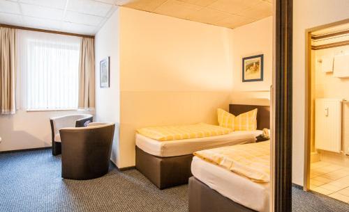 Ένα ή περισσότερα κρεβάτια σε δωμάτιο στο Hotel Quellental