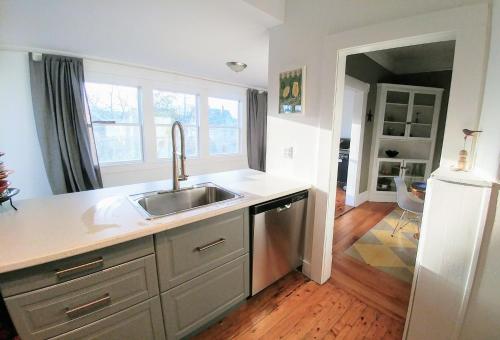 a kitchen with a sink and a counter at Beside The Tulip Tree in Shelburne