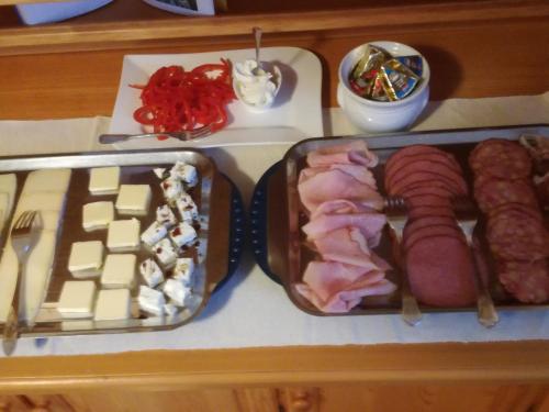 a tray of food with meat and other foods on a counter at Gästehaus Schleich in Bad Radkersburg
