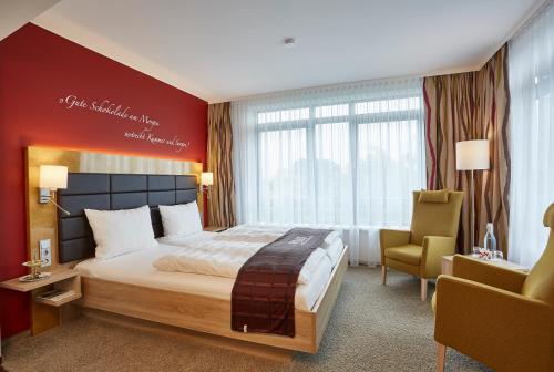 Postel nebo postele na pokoji v ubytování Das Schokoladenhotel