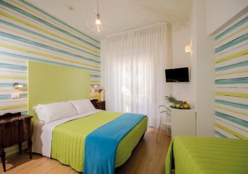 Postel nebo postele na pokoji v ubytování Hotel Trafalgar