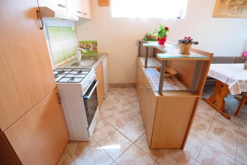 a small kitchen with a sink and a stove at Apartment Jorsi with Mountain View in Zreče