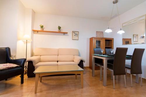 a living room with a couch and a table at Apartamento Cifuentes in Granada