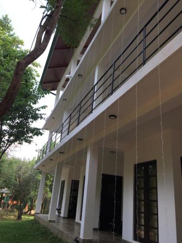 a building with strings hanging from the side at Iwamisou in Sigiriya