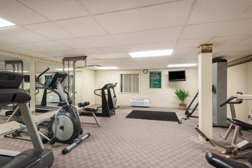 a gym with treadmills and elliptical machines at Ramada Plaza by Wyndham Portland in Portland