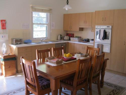 A kitchen or kitchenette at Heritage Guesthouse