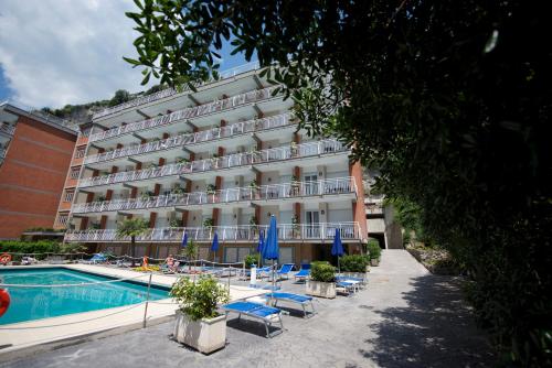 a hotel with a swimming pool next to a building at Angelina Residence in Maiori
