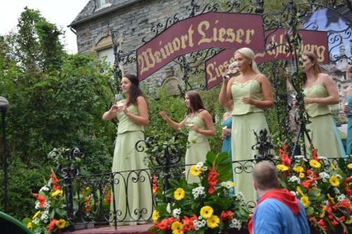 a group of women in dresses standing on a gate at B&B Prosterath-Hochwald in Prosterath