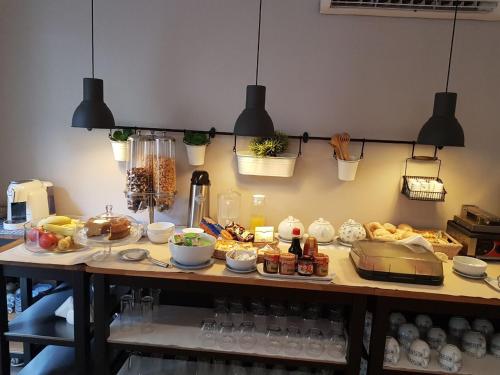 a table with a bunch of food on it at Casas de Luanda-GH Kinaxixe in Luanda