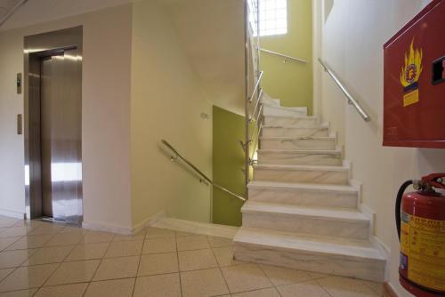 a stairway in a building with a stair case at Morfeas Hotel in Argos