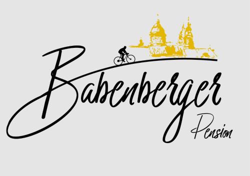 uma inscrição da palavra barman com uma bicicleta e um castelo em Pension Babenberger em Melk