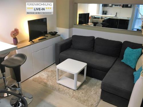 Posezení v ubytování Tiny Apartment LIVE-IN Wertheim am Main