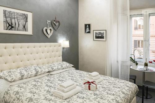 Postel nebo postele na pokoji v ubytování Relais Cavour Inn