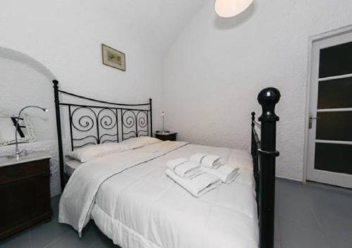 Postel nebo postele na pokoji v ubytování Santoimage house