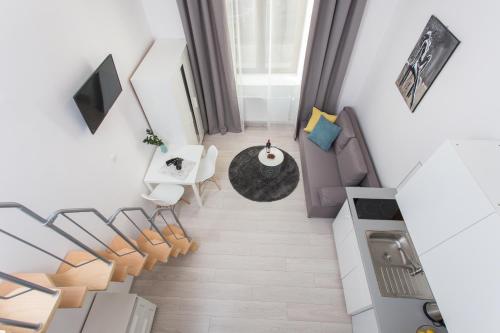 an overhead view of a living room with a couch and chairs at Krakow B&B - Old Town in Krakow