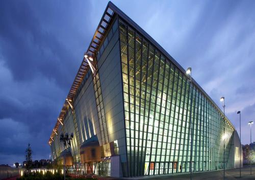a large glass building with a lot of windows at Bacio di Dama Lingotto in Turin