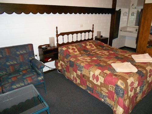 A bed or beds in a room at Bordertown Motel