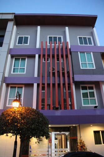 a building with a giant chair in front of it at KL Hotel in Labuan